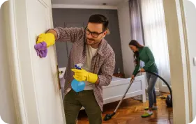 man cleaning wall