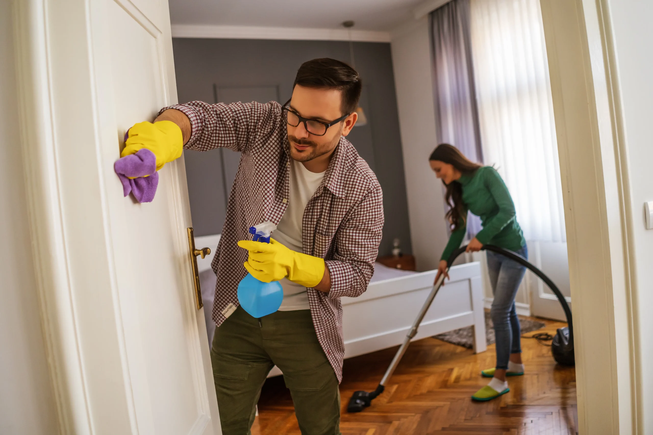 man cleaning wall